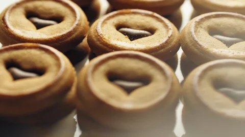 Mini biscuits filled with cocoa cream rotating close-up Stock Footage 102026099