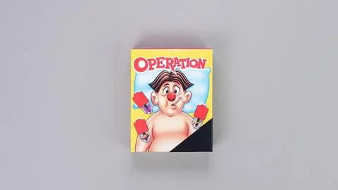 Mini board game on grey background. Fun games to play with kids. Boxes of Ope Stock Photos