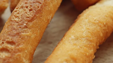 Mini bread sticks presentation macro close up presentation slowly rotating .. Stock Footage 344689701