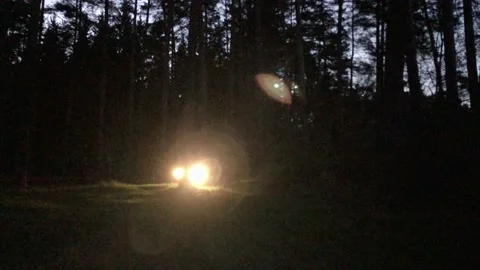 Mini Bus Rides through the Dark Forest. Night Stock Footage 130578042
