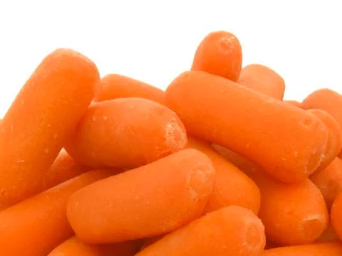 Mini carrots bottom border on white background Stock Photos
