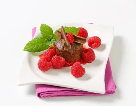 Mini chocolate cake with fresh raspberries Stock Photos