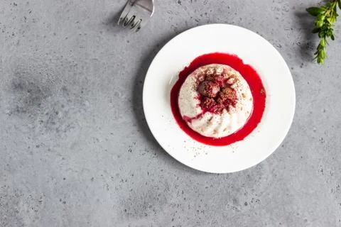 Mini chocolate cheesecake with raspberry sauce and mint. Stock Photos