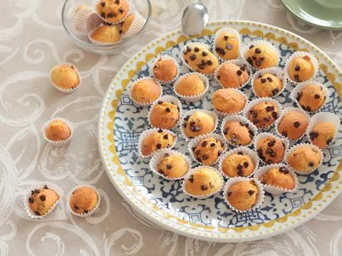 Mini chocolate cupcakes on patterned ceramic plate. Holidays and lifestyle. Food Stock Photos
