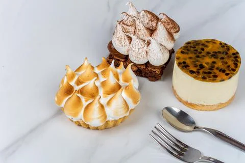 Mini chocolate, lemon pie and passion fruit cake. Stock Photos