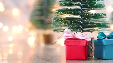 Mini Christmas tree with mini blue and red Christmas gifts Stock Footage 143457043