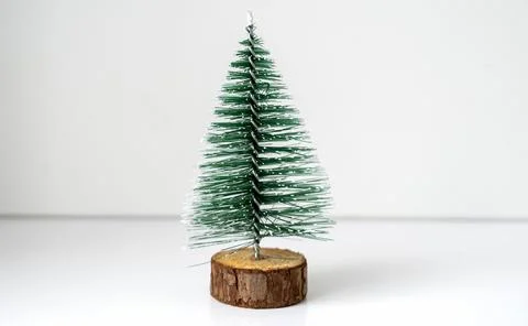 Mini Christmas tree on the table on a white background Fotos de archivo