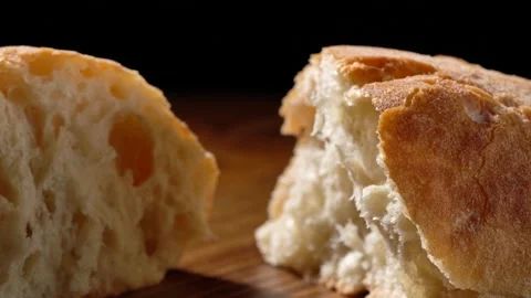 Mini ciabatta on a wooden surface close up Video stock 166499775