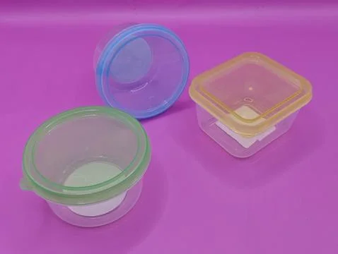 Mini containers on a bright background Stock Photos