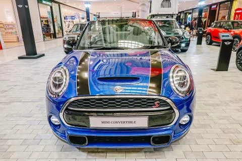 Mini Convertible is car front with round light and blue and black shiny colors Stock-Fotos