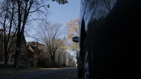 Mini Cooper driving down the street Stock Footage 34028367