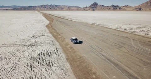 Mini Cooper Exploring Salt Flats Stock Footage 104581682