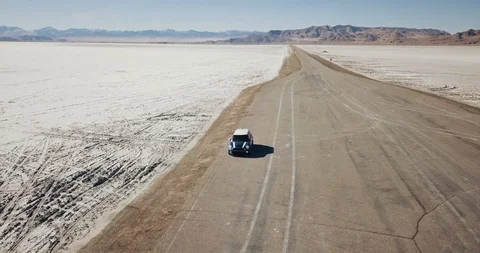 Mini Cooper Exploring Salt Flats Stock Footage 104581734