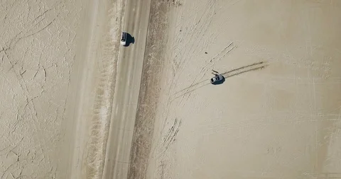 Mini Cooper Exploring Salt Flats Stock Footage 104581756