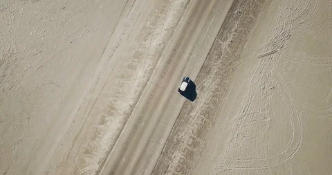 Mini Cooper Exploring Salt Flats Stock Footage 104581777