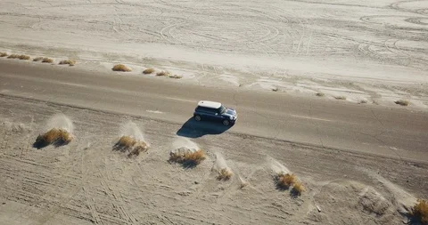 Mini Cooper Exploring Salt Flats Stock Footage 104584268