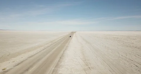 Mini Cooper Exploring Salt Flats Stock Footage 104688026