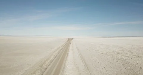 Mini Cooper Exploring Salt Flats Stock Footage 104688051