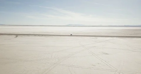 Mini Cooper Exploring Salt Flats Stock Footage 104688052