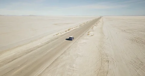 Mini Cooper Exploring Salt Flats Stock Footage 104688207