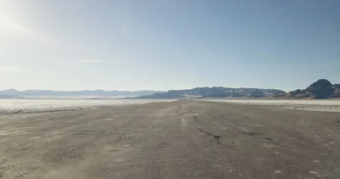 Mini Cooper Exploring Salt Flats Stock Footage 104690737