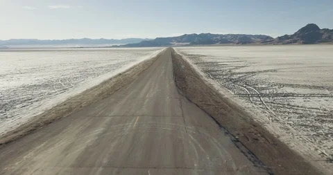 Mini Cooper Exploring Salt Flats Stock Footage 104690771