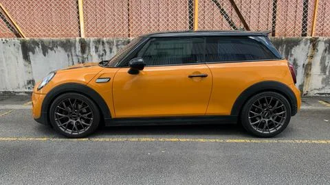 MINI Cooper S 3-door hatchback, Orange body with a black roof Stock Photos