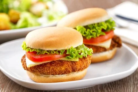 Mini Crispy Chicken Burger with Lettuce Tomato and Cheese. Stock Photos