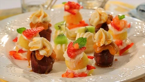 Mini desserts and sweets rotating on plate 1 Video stock 102136333
