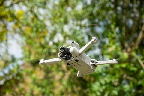 Mini drone captured in mid-flight Stock Photos