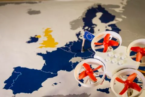 Mini drone flying over a EU map. European rules for drone aerial aircraft law Stock Photos