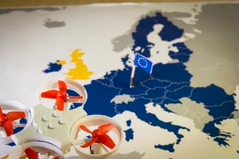Mini drone flying over a EU map. European rules for drone aerial aircraft law Foto stock