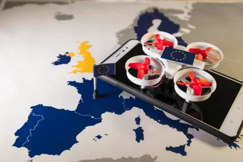 Mini drone flying over a EU map. European rules for drone aerial aircraft law Stock Photos