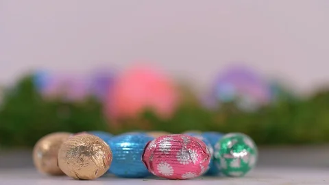 Mini Easter Eggs Wrapped in Silver Foil rotating. Easter Video stock 129203706