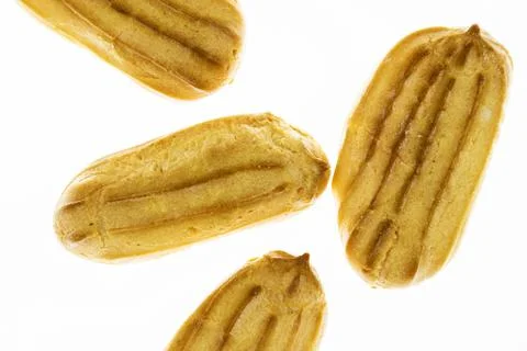 Mini eclairs on a white background. Stock Photos