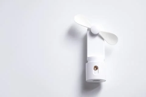Mini electric fan with handle isolated on white background Stock Photos