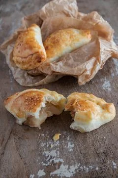 Mini empanadas stuffed with apple compote and cinnamon Stock Photos