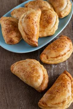 Mini empanadas stuffed with apple compote and cinnamon Stock Photos