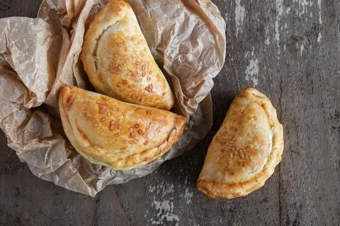 Mini empanadas stuffed with apple compote and cinnamon Stock Photos