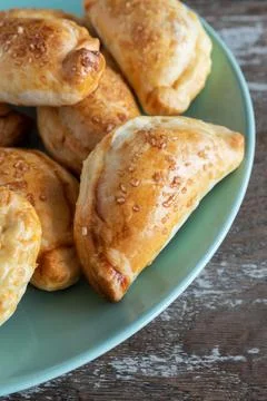Mini empanadas stuffed with apple compote and cinnamon Stock Photos
