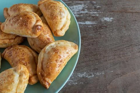 Mini empanadas stuffed with apple compote and cinnamon Stock Photos