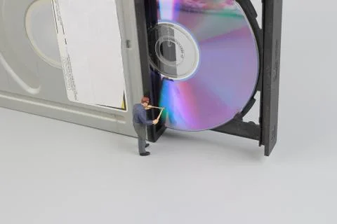 Mini engineer and worker fixed to clean CD rom Stock Photos