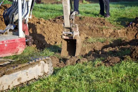 Mini excavator on construction site. Stock Photos