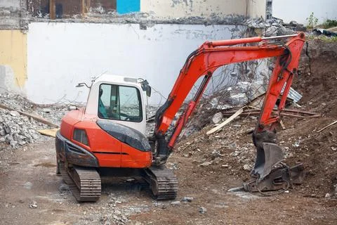 Mini excavator on a construction site Stock Photos