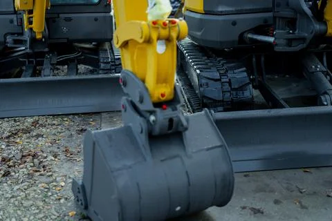 Mini excavator digging bucket assembly with hydraulic actuator joints Stock Photos