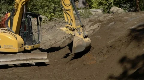 Mini excavator moving dirt. Stock Footage 8686732