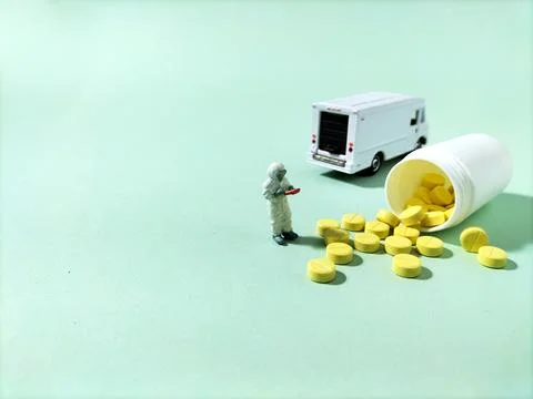 Mini figure checking medicines Stock Photos