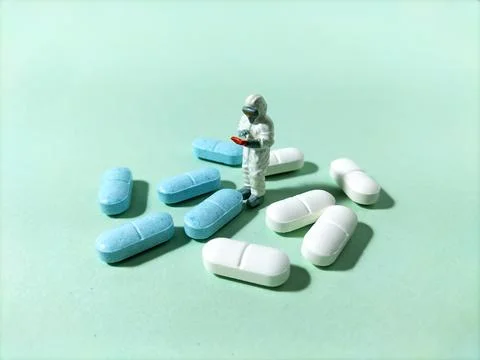 Mini figure checking medicines Stock Photos