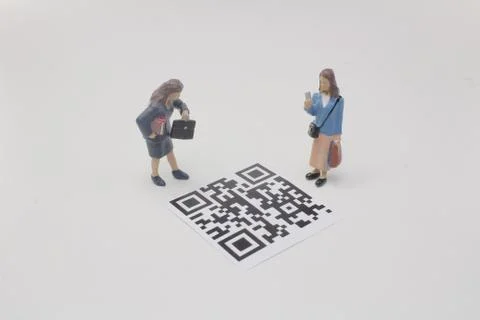 A mini figure screen the 2D bar code Foto stock
