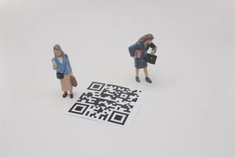 A mini figure screen the 2D bar code Foto stock